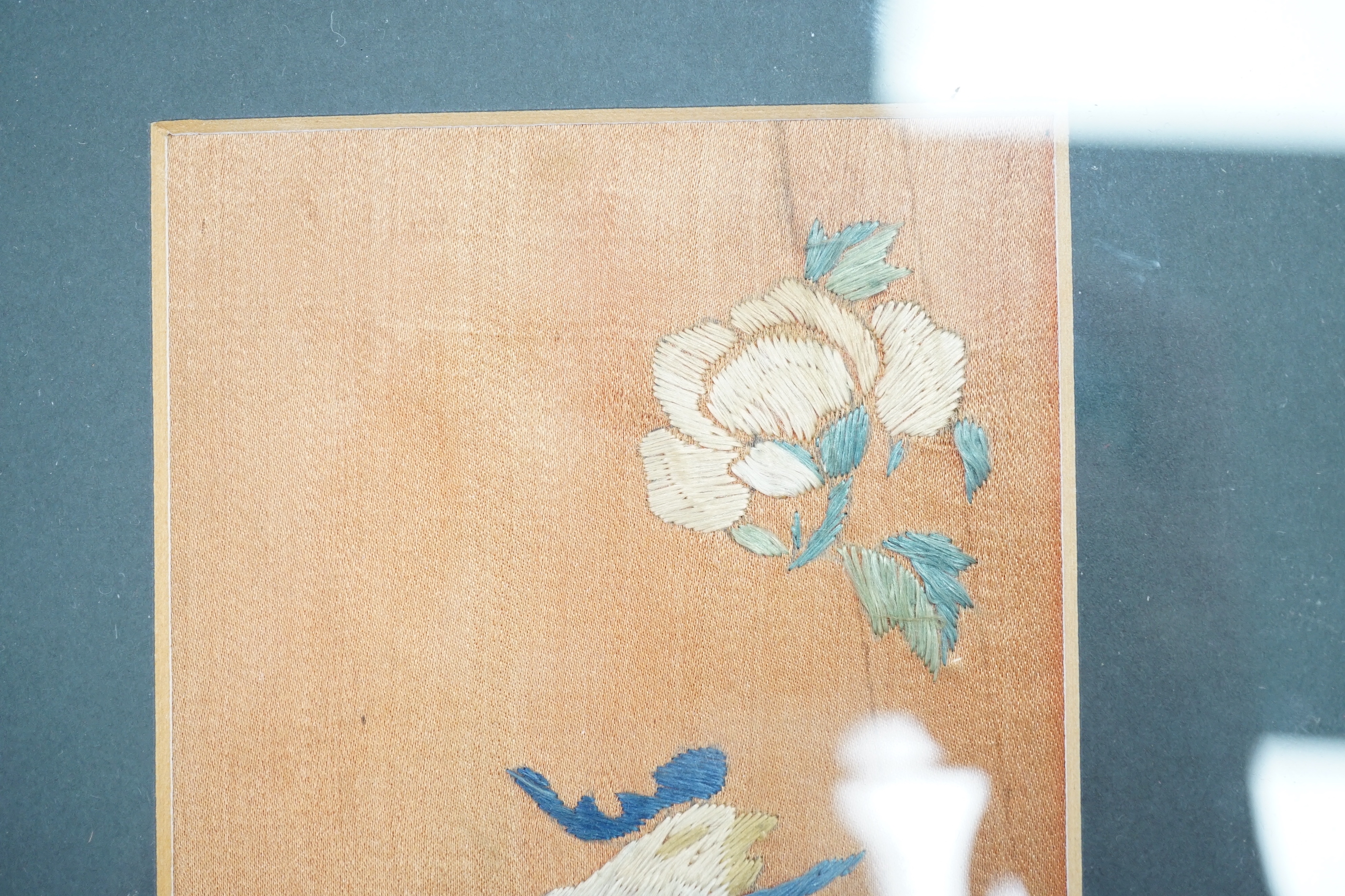 Two Chinese hardwood and mixed soapstone panels and a silk embroidered panel, largest 14.5cm x 29.5cm high